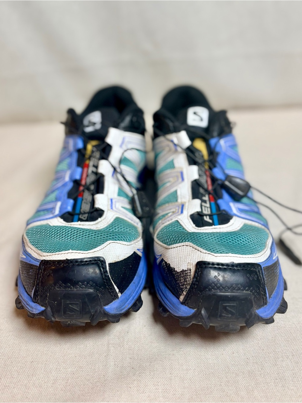 Salomon woman’s Sneakers in Teal, Blue, White and Black size 10